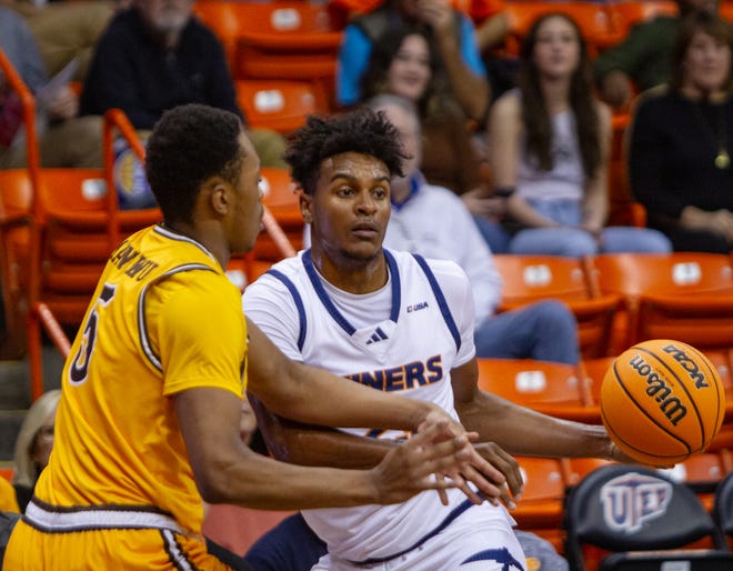 UTEP's Otis Frazier III attempts to get past a University of Wyoming defender during the WestStar Sun Bowl Invitational at the Don Haskins Center on Dec. 21, 2023.